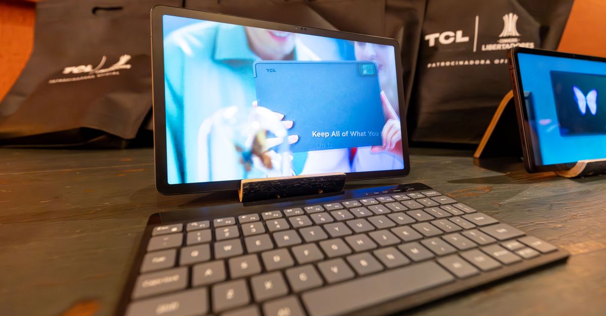 High-quality image of a tablet with a wireless keyboard in a tech showcase setting.